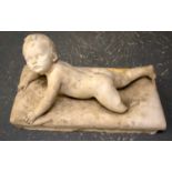 A MID 19TH CENTURY ITALIAN CARVED MARBLE FIGURE OF A RECLINING BOY modelled upon a rectangular