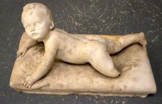 A MID 19TH CENTURY ITALIAN CARVED MARBLE FIGURE OF A RECLINING BOY modelled upon a rectangular