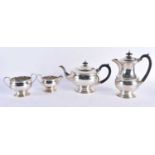 A SILVER FOUR PIECE TEASET. 1527 grams. Sheffield 1945. Largest 20 cm x 16.5 cm. (4)