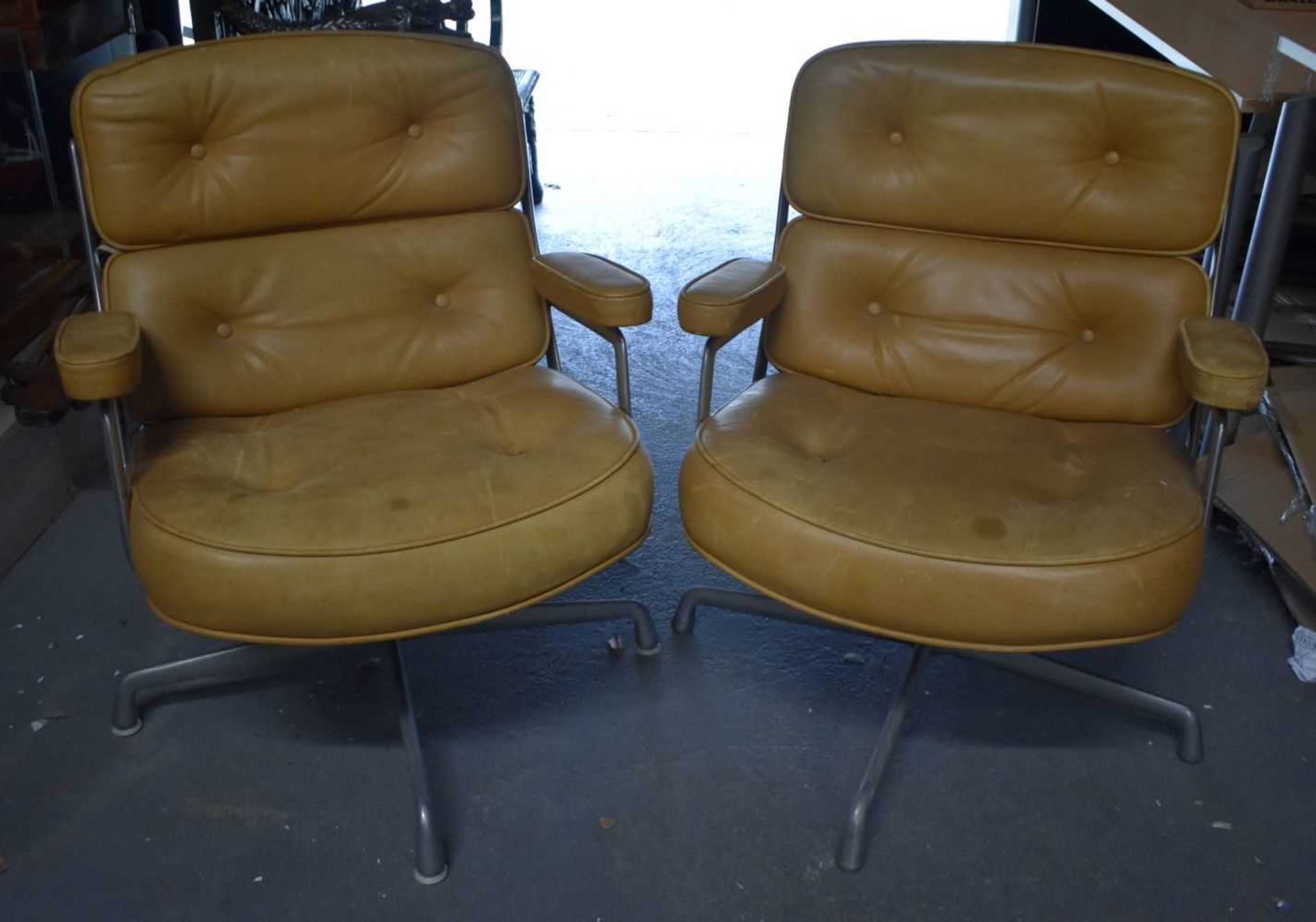 A STYLISH PAIR OF HERMAN MILLER LEATHER SWIVEL CHAIRS. 78 cm x 62 cm.