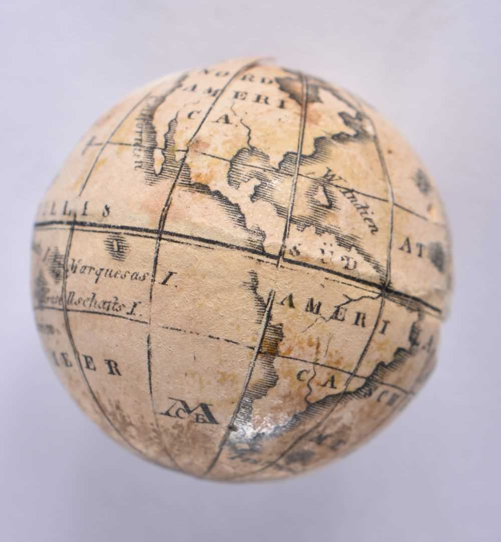 AN EXTREMELY RARE ANTIQUE CARVED NUT GLOBE the body rotating to reveal a tiny pocket globe. Nut 6 cm - Image 5 of 20