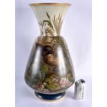 AN UNUSUAL LARGE VICTORIAN OPALINE GLASS VASE painted with birds within landscapes. 53 cm x 25 cm.