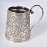 A White Metal Tankard with Embossed Jungle Scene. 8.3cm x 8.9cm x 6.2cm, weight 98g