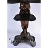 A LARGE 19TH CENTURY BAVARIAN BLACK FOREST CARVED WOOD BEGGING DOG STAND modelled with glass eyes,