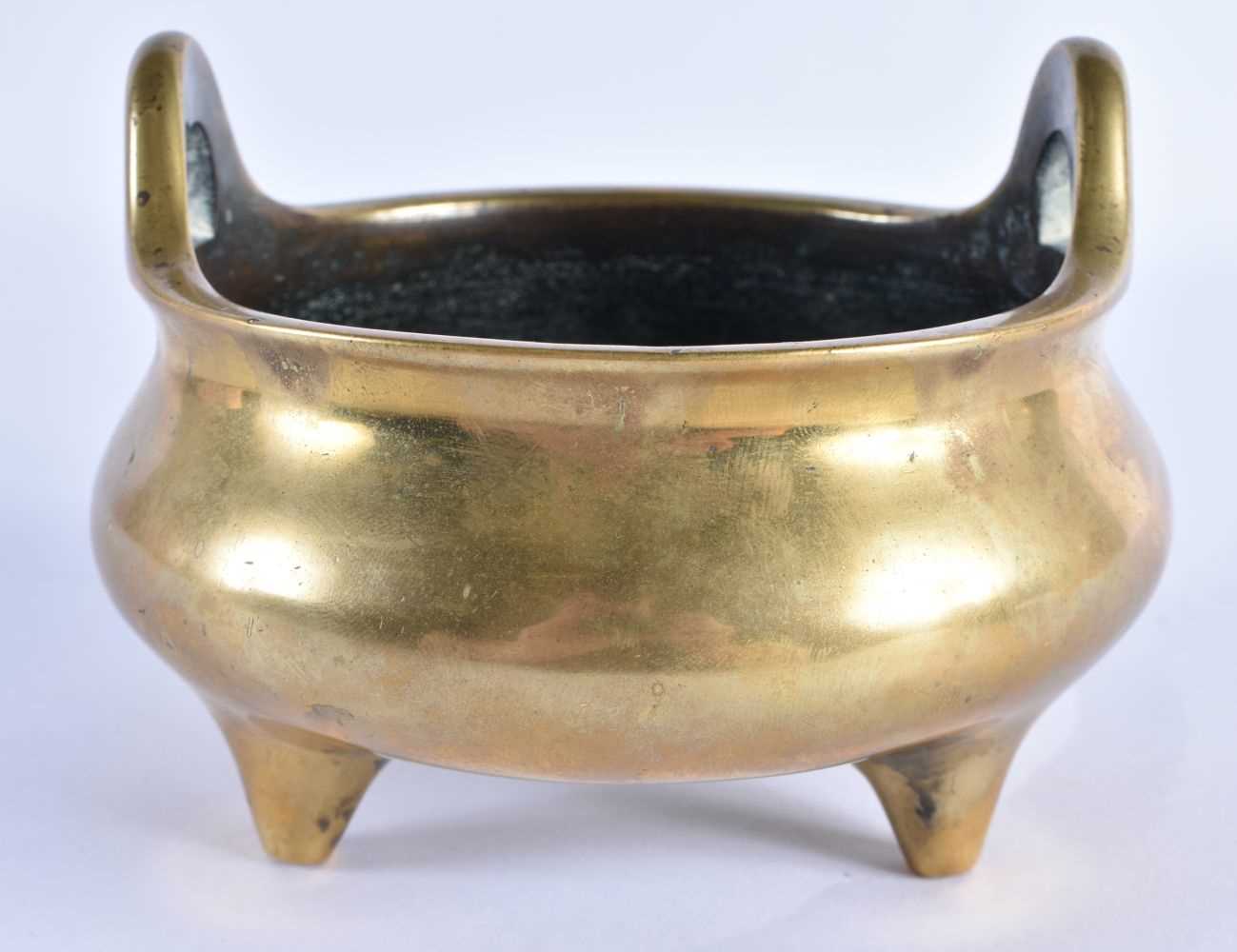 AN 18TH CENTURY CHINESE TWIN HANDLED BRONZE CENSER with high loop handles, bearing Xuande marks to - Image 4 of 7