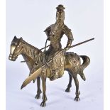 A CHINESE QING DYNASTY BRONZE FIGURE OF A WARRIOR ON HORSEBACK inset with gems, embellished in