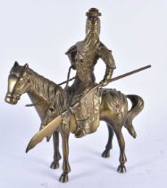 A CHINESE QING DYNASTY BRONZE FIGURE OF A WARRIOR ON HORSEBACK inset with gems, embellished in