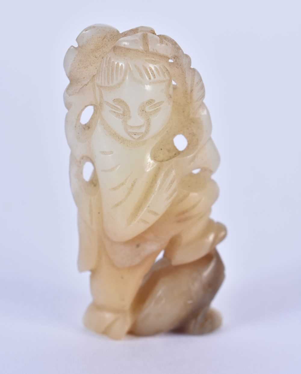A 19TH CENTURY CHINESE CARVED JADE FIGURE OF A BOY Qing, modelled standing upon a toad. 5 cm x 2.5