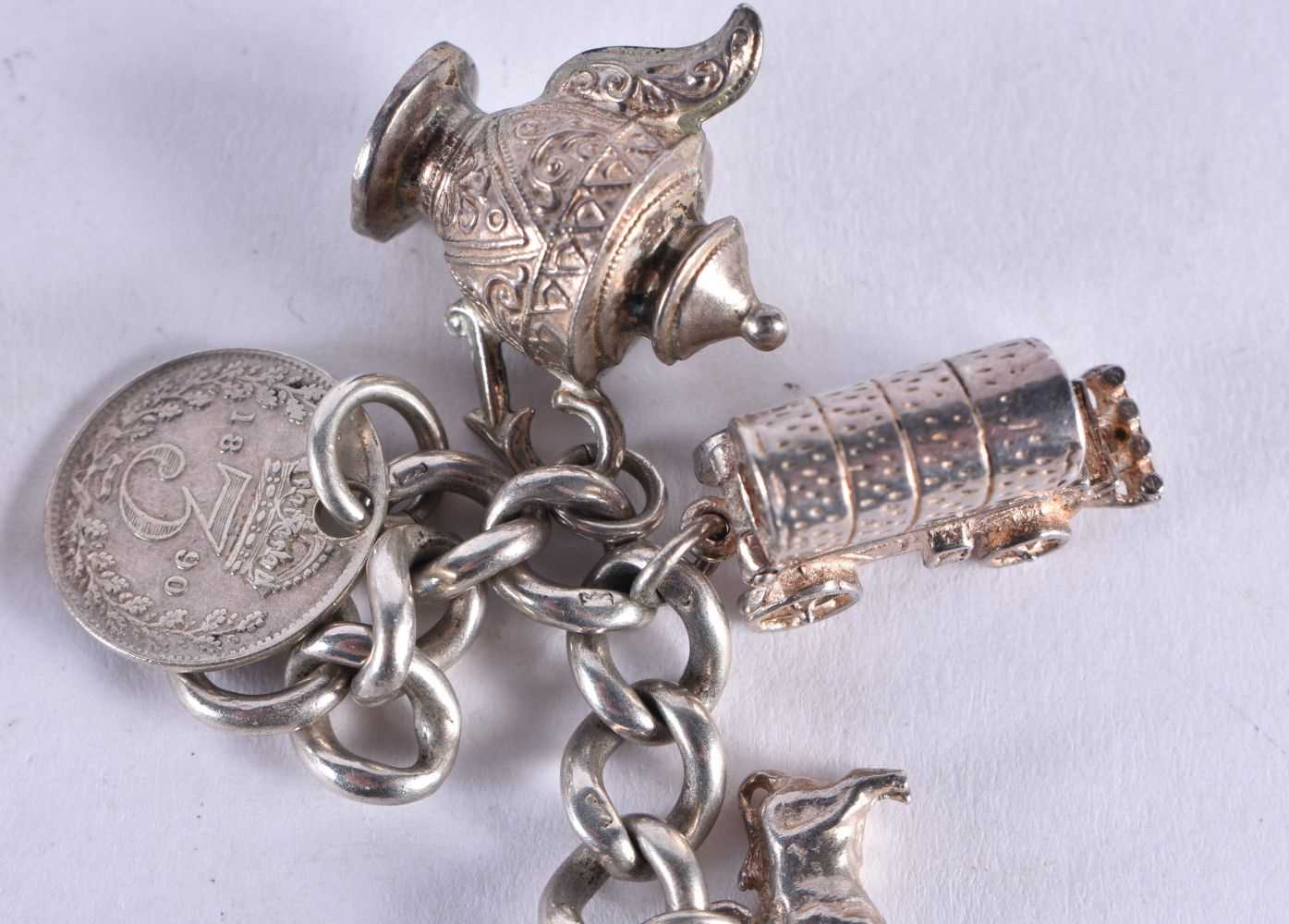 A SILVER CHARM BACELET. 74.6 grams. 20 cm wide. - Image 4 of 5
