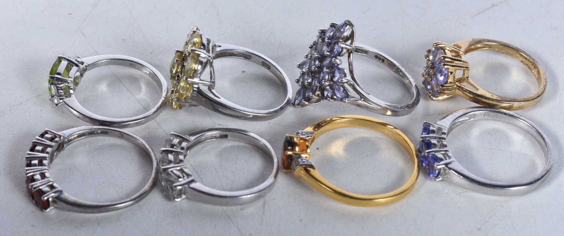 A collection of silver gemstone rings including Tanzanite. Stamped 925. Sizes L-U, total weight - Image 2 of 2
