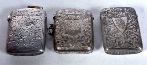 Three Victorian Engraved Silver Vesta Cases. Hallmarks include Birmingham 1898. Largest 4.7cm x 3.