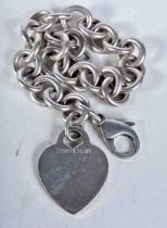 Silver bracelet with heart tag by designer Tiffany & Co. Stamped Tiffany 925. 18.5cm long, weight