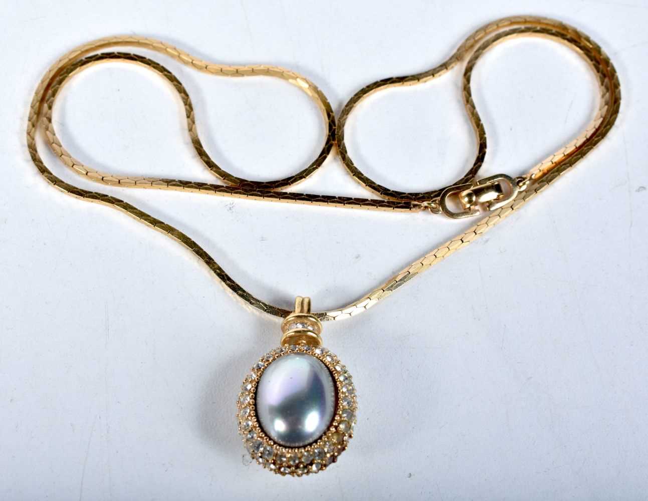 Gold tone necklace with simulated pearl pendant by designer Christian Dior. Stamped Dior. Chain 60cm