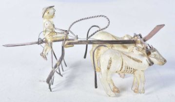 A Silver Filigree Model of Oxen pulling a Farmer on a Plough. Stamped 925. 13cm x 6cm x 6cm,
