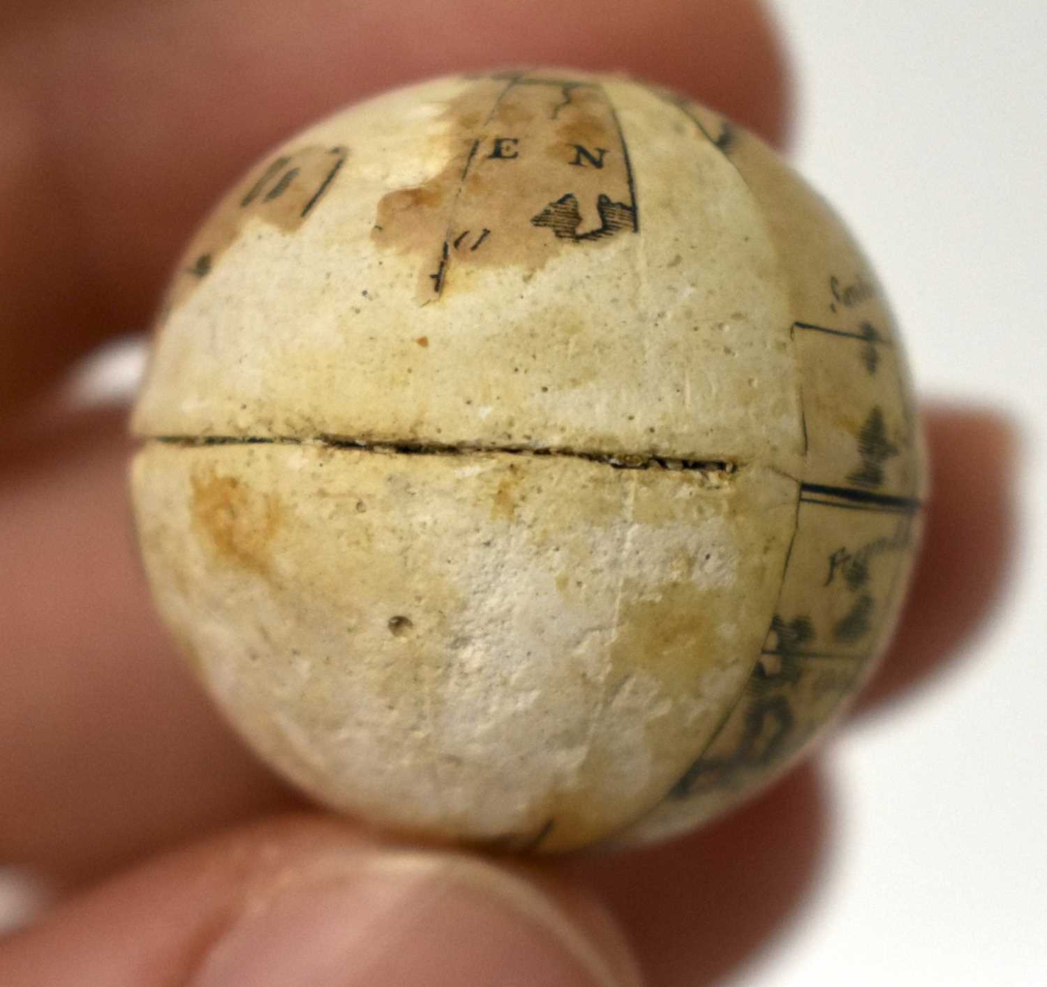 AN EXTREMELY RARE ANTIQUE CARVED NUT GLOBE the body rotating to reveal a tiny pocket globe. Nut 6 cm - Image 15 of 20