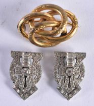 AN ANTIQUE YELLOW METAL BROOCH together with an art deco clip. 25 grams. Largest 3.75 cm x 2.75