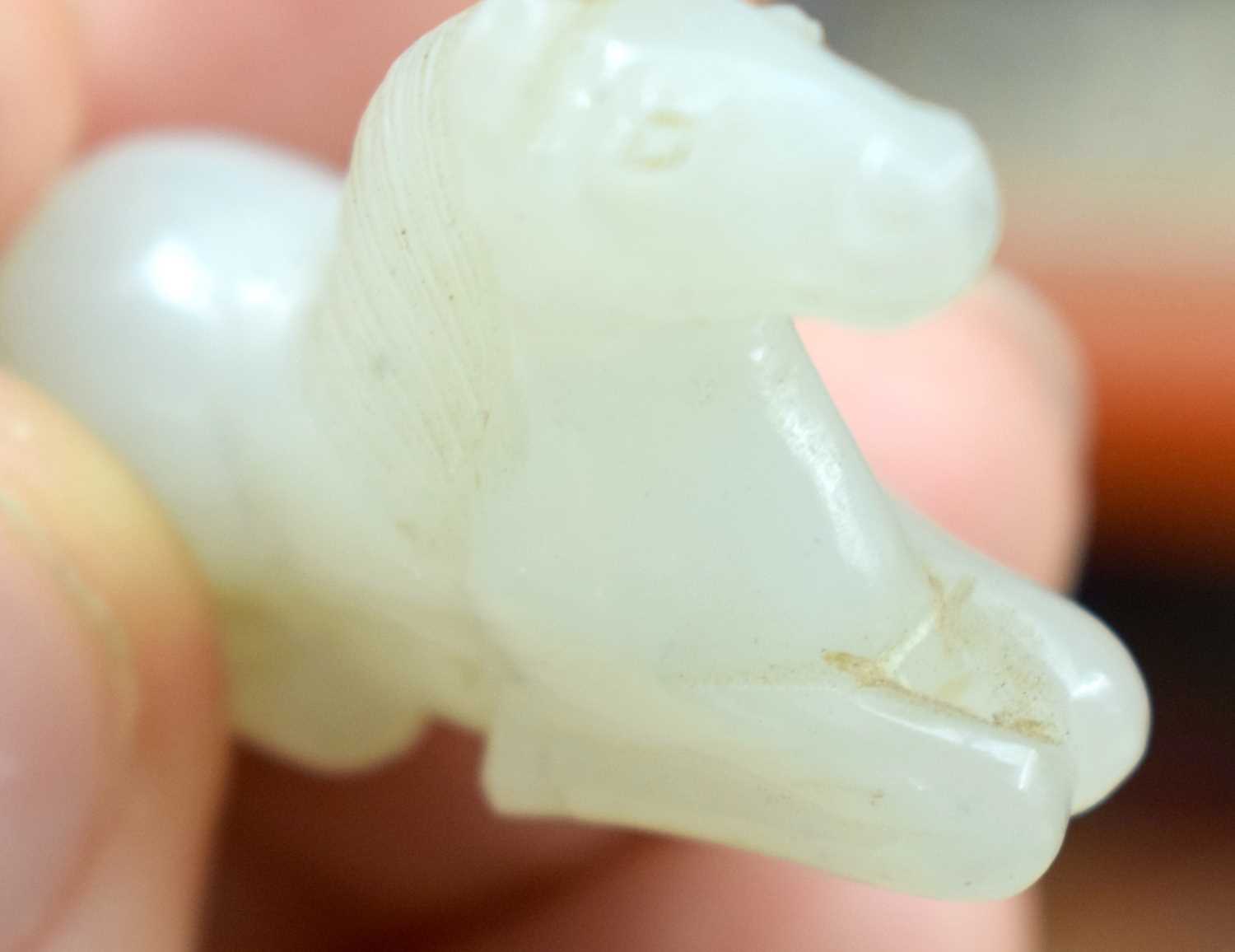 A 19TH CENTURY CHINESE CARVED WHITE JADE FIGURE OF A RECUMBANT HORSE Qing. 3 cm x 2 cm. - Image 9 of 12