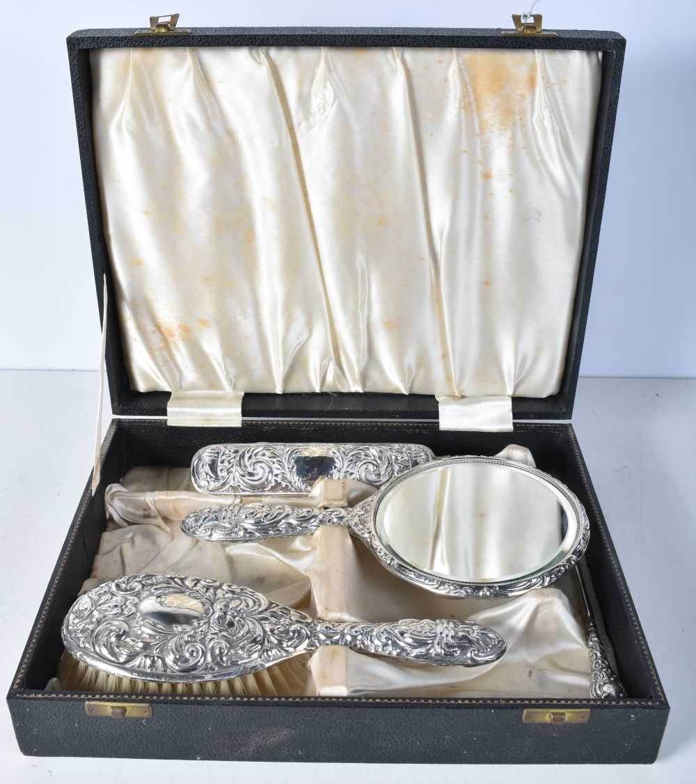A Cased Silver Vanity Set incl Hairbrush, Mirror, Clothes Brush and Button Hook. Hallmarked