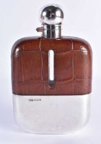 A Leather Covered Silver and Glass Hip Flask by James Dixon and Sons. Hallmarked Sheffield 1924,