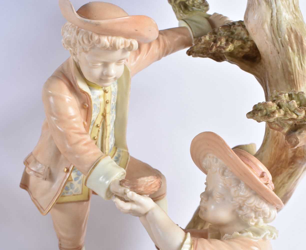 A RARE PAIR OF ROYAL WORCESTER HADLEYS BLUSH IVORY FIGURAL CANDLESTICKS modelled as children upon - Image 3 of 8