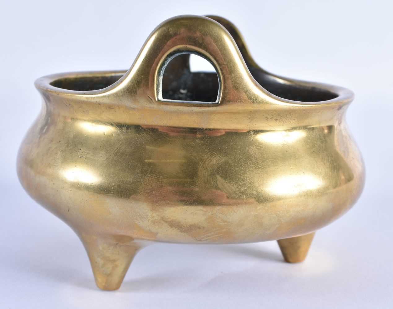 AN 18TH CENTURY CHINESE TWIN HANDLED BRONZE CENSER with high loop handles, bearing Xuande marks to - Image 5 of 7