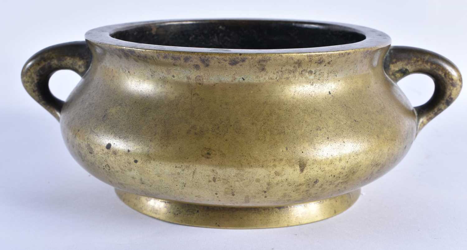 A LATE 18TH CENTURY CHINESE TWIN HANDLED BRONZE CENSER bearing Xuande marks to base. 1847 grams.