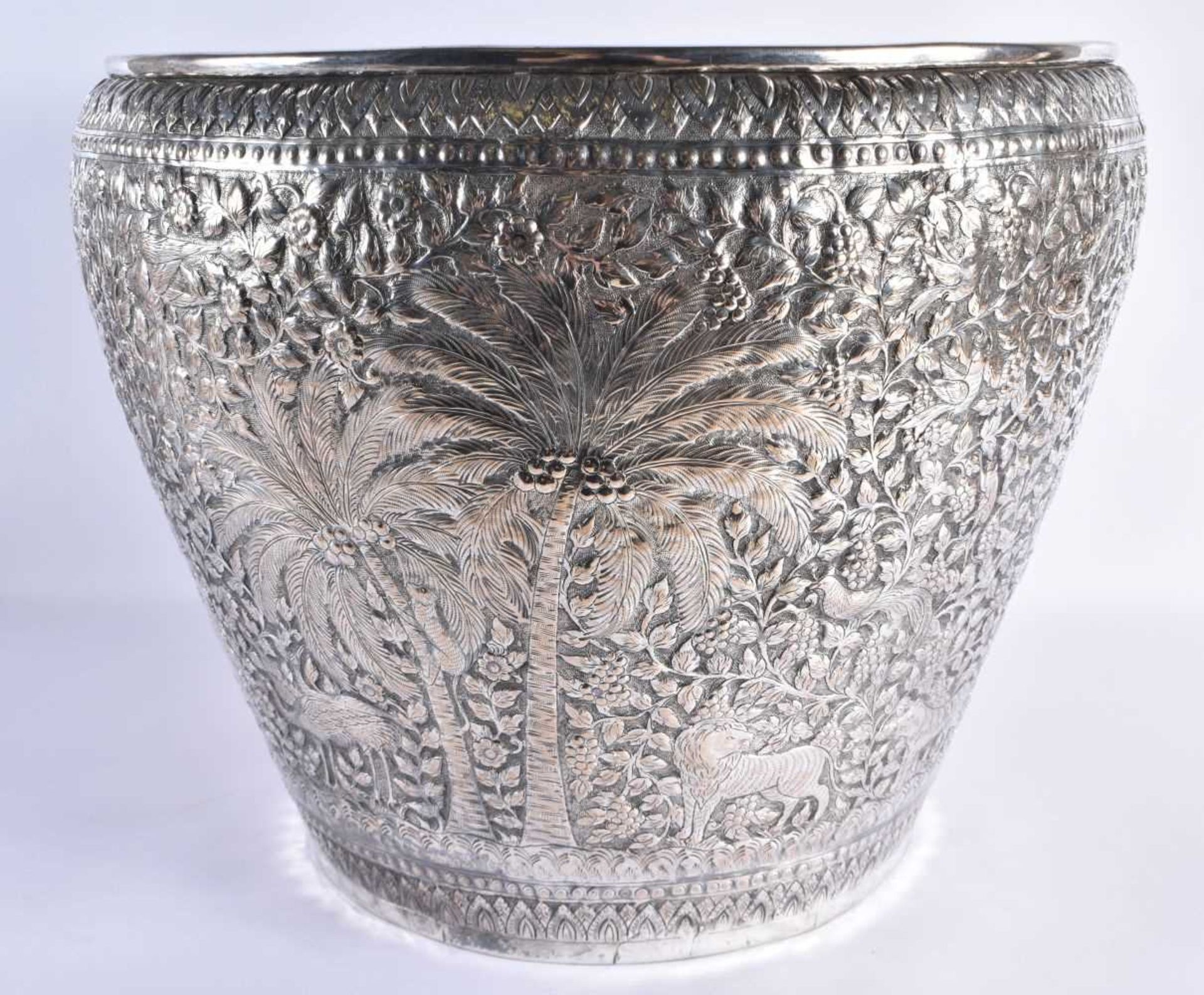 A VERY LARGE LATE 19TH CENTURY INDIAN WHITE METAL JARDINIERE decorative with animals and palm trees, - Image 3 of 5