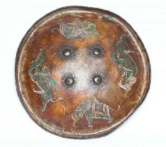 AN INDIAN DHAL HIDE SHIELD, 19th century, of circular form, with four lobed brass bosses linked to