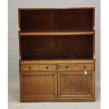 A REGENCY MAHOGANY BOOKCASE, early 19th century, the reeded edged back with single fixed shelf,