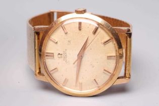 A GENTLEMAN'S 18CT GOLD OMEGA AUTOMATIC WRISTWATCH, the champagne dial with metal batons and central