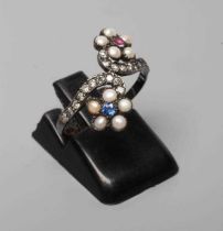 A GEORGIAN STYLE RING, the two off-set flower heads centred by a close back set blue and red stone