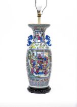 A CANTONESE PORCELAIN FAMILLE ROSE TWO HANDLED ROULEAU VASE painted with two panels of court