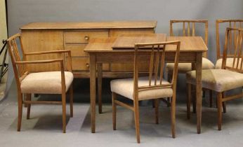 A GORDON RUSSELL WALNUT DINING SUITE, c.1950's, comprising sideboard with three central drawers