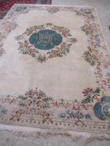 A CHINESE CARPET, second half 20th century, of Aubusson type, the ivory field and main border with