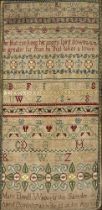 A GEORGE II LONG SAMPLER,1743, worked in coloured silks on a fine linen ground in full, half and