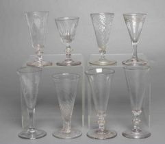 A COLLECTION OF SEVEN GLASS FLUTES, late 18th century and later, including one with wrythen fluted