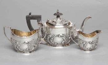 A BACHELOR'S EDWARDIAN SILVER COMPOSITE THREE PIECE TEA SERVICE, maker possibly E G Parker,