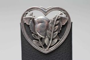 A GEORG JENSEN SILVER HEART SHAPED BROOCH designed by Arno Malinowski cast with a bird and leaves,