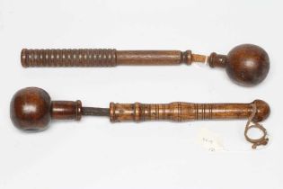 A BOATSWAIN'S KOSH, 19th century, with spherical head, flexible leather link and turned grip,