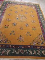A CHINESE CARPET, early 20th century, the gold field with scattered floral sprays, floral central