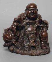 A CHINESE CARVED HARDWOOD BUDDAH, seated wearing a long bead necklace and with three children in