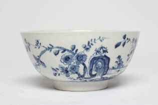 A FIRST PERIOD WORCESTER PORCELAIN BOWL, c.1755-60, painted in underglaze blue with the Prunus Fence