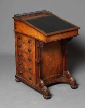 AN EARLY VICTORIAN BURR WALNUT AND MARQUETRY DAVENPORT with gilt metal gallery surmount, green