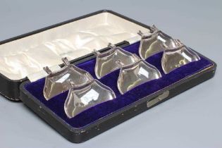 A SET OF SIX INDIVIDUAL SILVER CONDIMENT TRAYS, maker H J Cooper, Birmingham 1911, of shaped