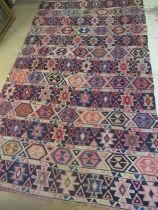 A LARGE FLAT WEAVE KILIM, modern, with bands of geometric motifs in shades of blue, pink and