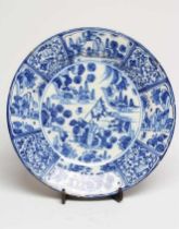 A DUTCH DELFT CHARGER of plain circular form, painted in blue in the Kraak style with a central