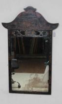 A CHINOISERIE BLACK LACQUERED PIER GLASS, 19th century, the oblong plate within a plain frame with