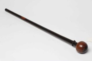 A ZULU KNOBKERRIE, late 19th century, with 28" shaft tapering to the grip and bi-colour head, 30 1/