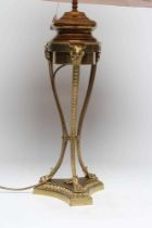 A BRASS NEO-CLASSICAL STYLE TABLE OIL LAMP, early 20th century, the ogee moulded reservoir raised on
