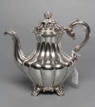 A WILLIAM IV COFFEE POT, maker The Barnards, London 1835, of lobed baluster form, the hinged cover